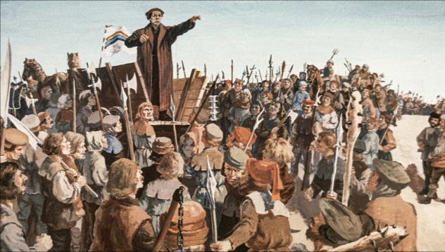 Der Reformator Thomas Müntzer spricht vor den revoltierenden Bauern im Jahr 1524. Diese beriefen sich in ihrem Protest gegen Frondienste auch auf die Reformation. Doch schnell eskalierte die Gewalt. © akg-images
