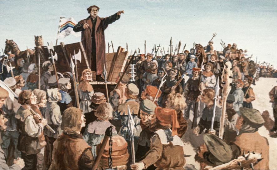 Der Reformator Thomas Müntzer spricht vor den revoltierenden Bauern im Jahr 1524. Diese beriefen sich in ihrem Protest gegen Frondienste auch auf die Reformation. Doch schnell eskalierte die Gewalt. © akg-images